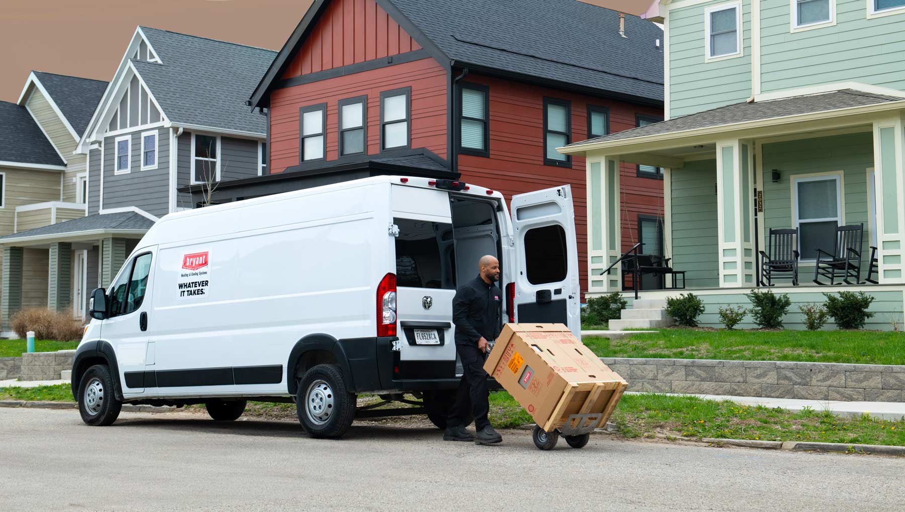 bryant van in front of houses with delivery of hvac system