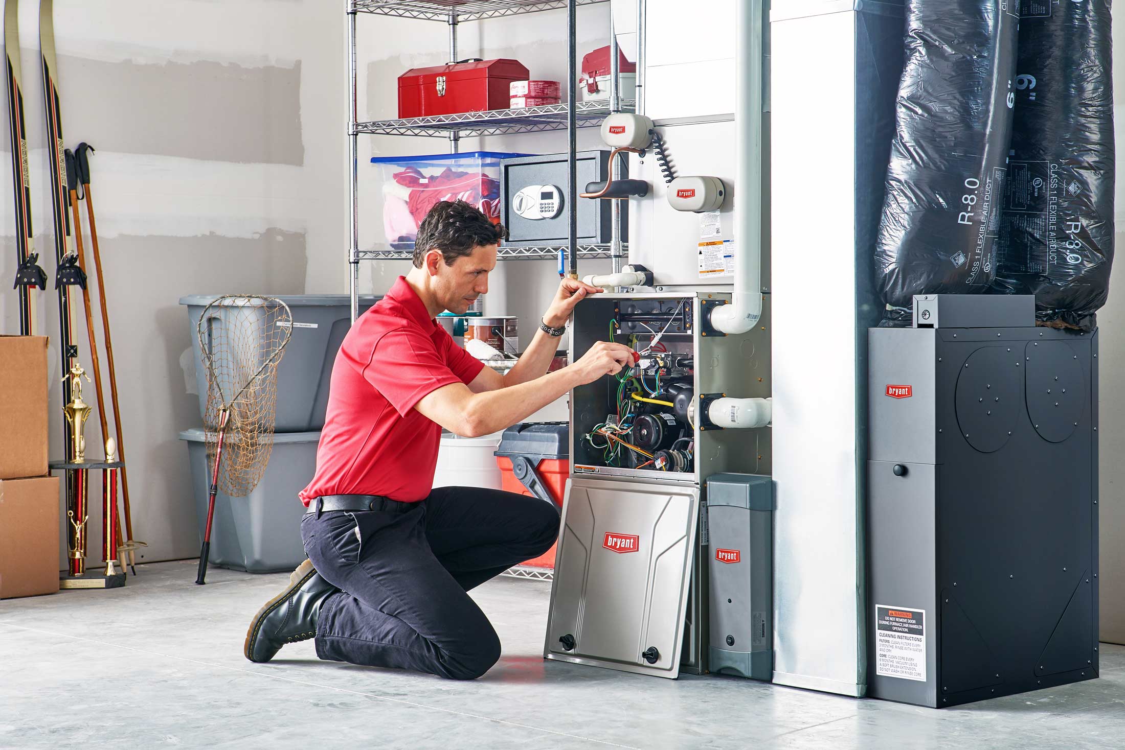 bryant hvac tech working on furnace